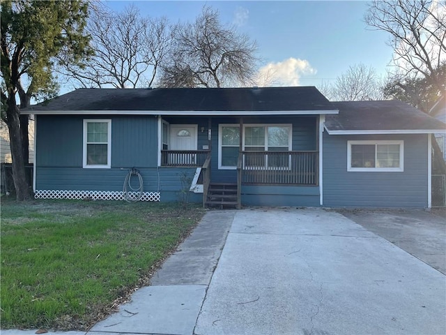 view of front of property with a front yard and covered porch