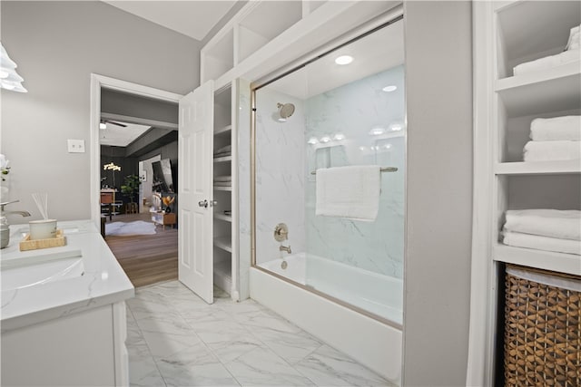 bathroom featuring vanity and tiled shower / bath combo