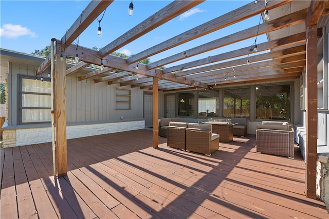 wooden terrace featuring an outdoor living space and a pergola