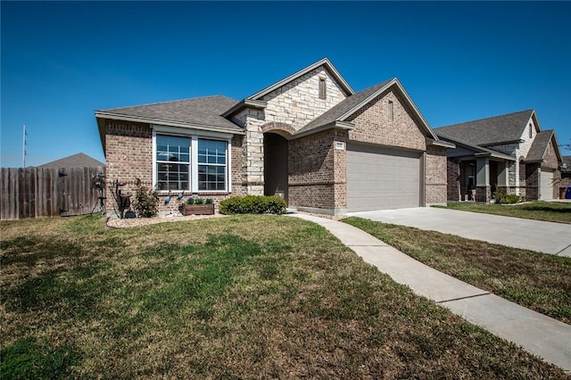 view of front facade featuring fence, concrete driveway, an attached garage, a front yard, and brick siding