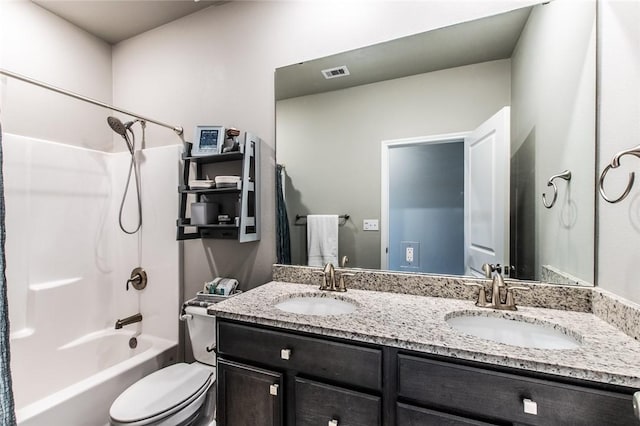 bathroom with double vanity, visible vents, tub / shower combination, and a sink