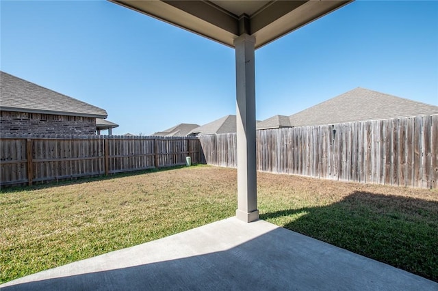 view of yard with a patio and a fenced backyard