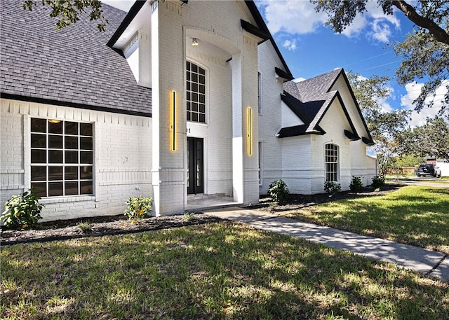 exterior space with a front lawn