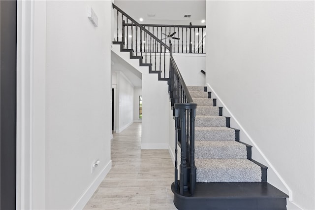 stairway featuring hardwood / wood-style flooring