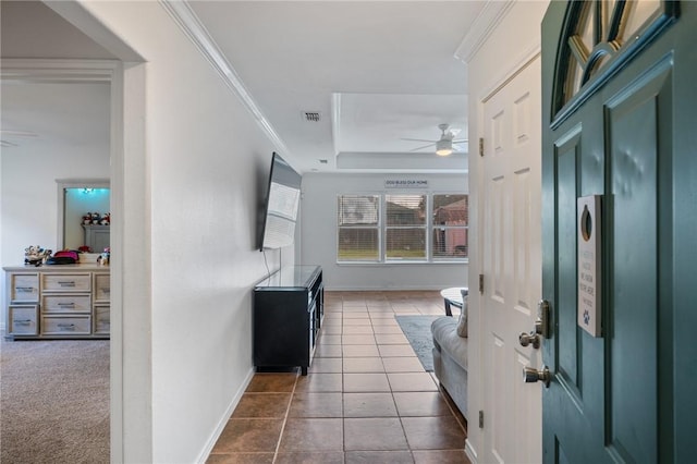 5642 Victor Lara Ortegon St, Corpus Christi, TX 78417 - foyer with ceiling fan, a raised ceiling, ornamental molding, and dark tile patterned flooring