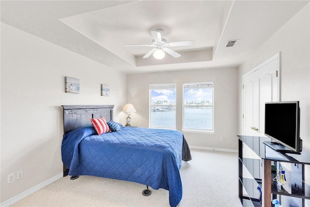 15410 Grass Cay Ct Unit A, Corpus Christi, TX 78418 - bedroom featuring visible vents, carpet flooring, baseboards, and a tray ceiling