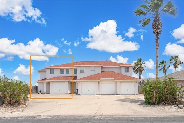 15410 Grass Cay Ct Unit A, Corpus Christi, TX 78418 - mediterranean / spanish-style home featuring fence, stucco siding, and concrete driveway