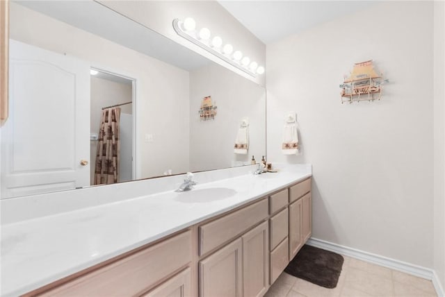 15410 Grass Cay Ct Unit A, Corpus Christi, TX 78418 - full bathroom with baseboards, tile patterned floors, double vanity, and a sink
