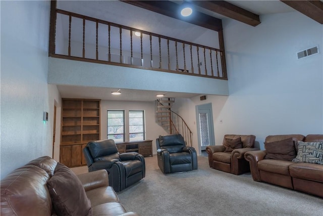 2413 Cricket Hollow St, Corpus Christi, TX 78414 - carpeted living room featuring a high ceiling, stairway, and beam ceiling