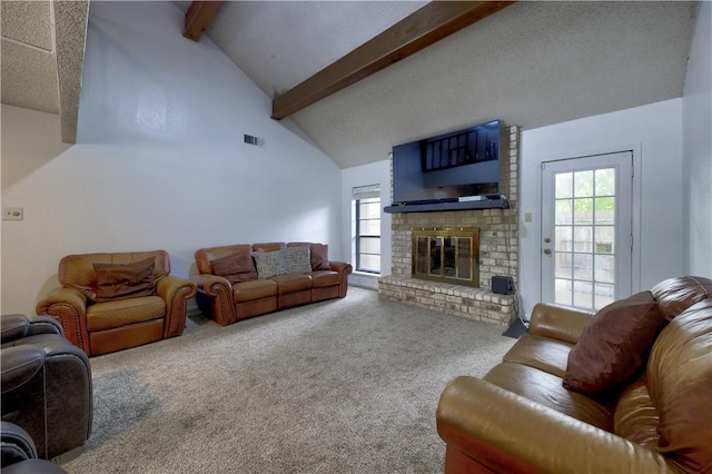 2413 Cricket Hollow St, Corpus Christi, TX 78414 - living room featuring carpet floors, beam ceiling, a fireplace, plenty of natural light, and high vaulted ceiling