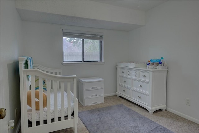 2413 Cricket Hollow St, Corpus Christi, TX 78414 - carpeted bedroom featuring a nursery area and baseboards