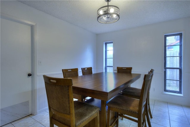 2413 Cricket Hollow St, Corpus Christi, TX 78414 - dining space with light tile patterned floors, a textured ceiling, and a chandelier