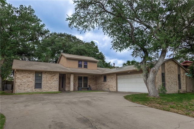 2413 Cricket Hollow St, Corpus Christi, TX 78414 - view of front of property with driveway, brick siding, an attached garage, and fence