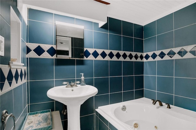 full bathroom featuring a whirlpool tub and tile walls
