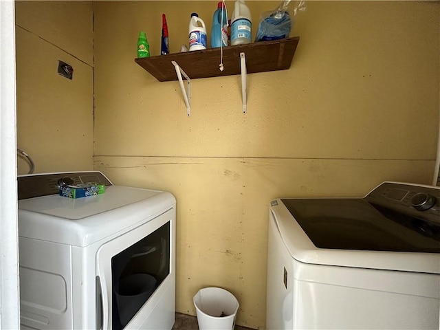 washroom with laundry area and separate washer and dryer