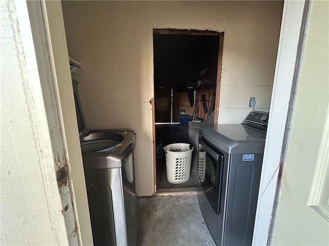 laundry area with laundry area and washer and clothes dryer