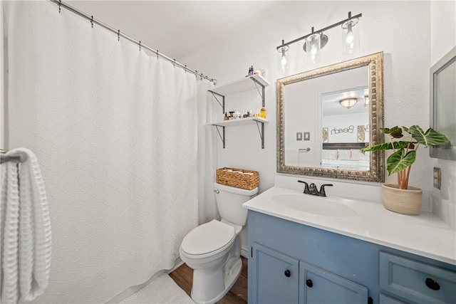 bathroom with hardwood / wood-style floors, vanity, and toilet