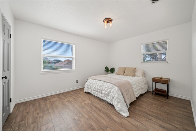 bedroom featuring wood-type flooring