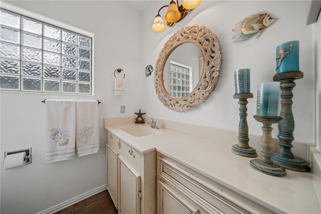 bathroom featuring hardwood / wood-style flooring and vanity