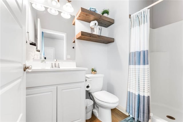 15022 Beach Walk, Corpus Christi, TX 78418 - bathroom with hardwood / wood-style floors, toilet, vanity, and a shower with curtain