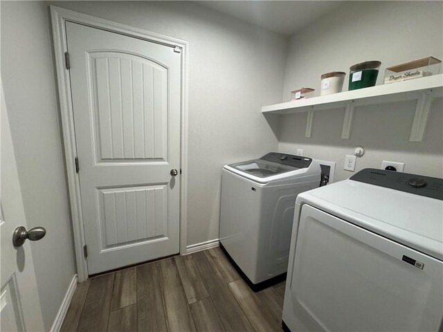 2682 Excelsior Blvd, Corpus Christi, TX 78415 - laundry room featuring washer and dryer, dark wood-style floors, and baseboards