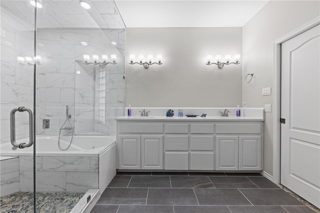 bathroom with independent shower and bath, vanity, and tile patterned floors