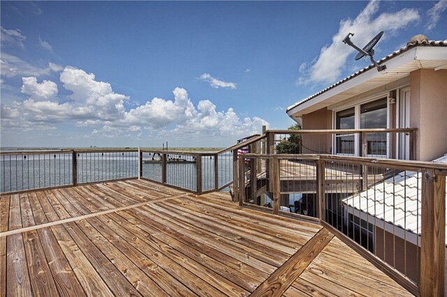 deck featuring a water view