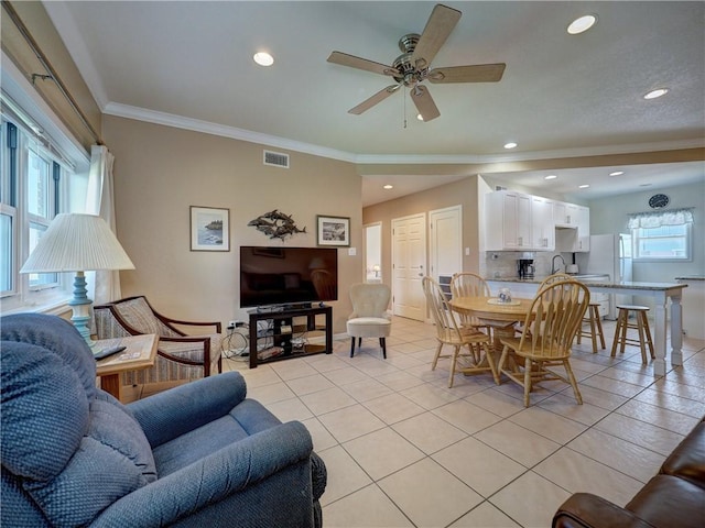 700 Island Retreat Rd Unit 37, Port Aransas, TX 78373 - living room with light tile patterned flooring, crown molding, recessed lighting, a ceiling fan, and baseboards