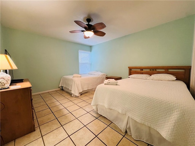 bedroom featuring ceiling fan and light tile patterned flooring