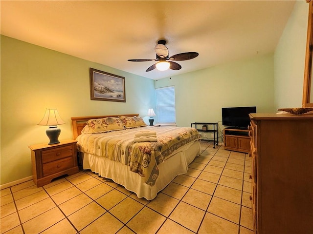 tiled bedroom with ceiling fan