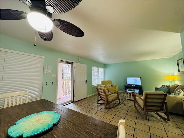 tiled living room featuring ceiling fan