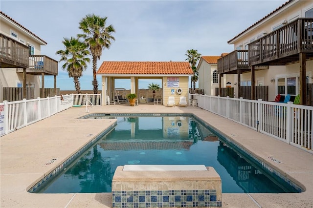 view of swimming pool with a patio area and a gazebo