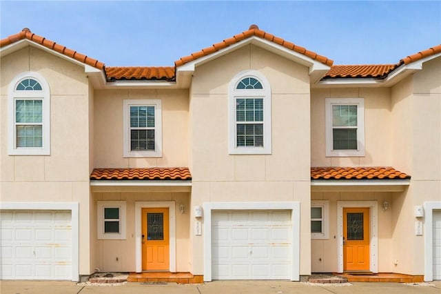 mediterranean / spanish house featuring a garage