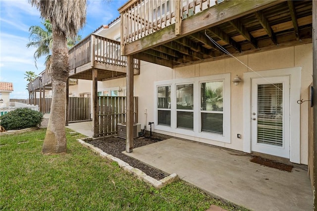 back of property featuring a patio area and a lawn