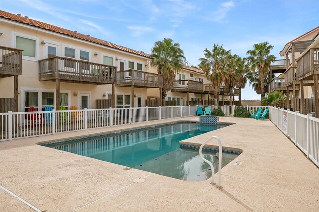 view of swimming pool with a patio