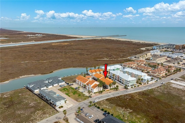 aerial view with a beach view and a water view