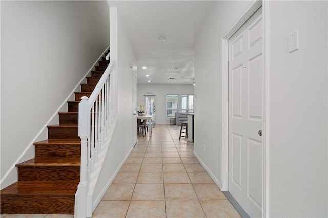 entryway featuring light tile patterned floors