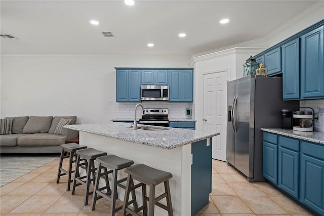 kitchen with sink, an island with sink, blue cabinetry, and stainless steel appliances