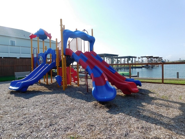 view of playground with a water view