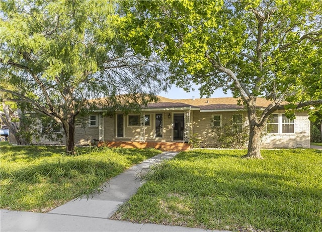 single story home featuring brick siding and a front yard