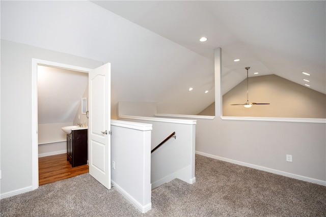bonus room featuring lofted ceiling, ceiling fan, and carpet floors