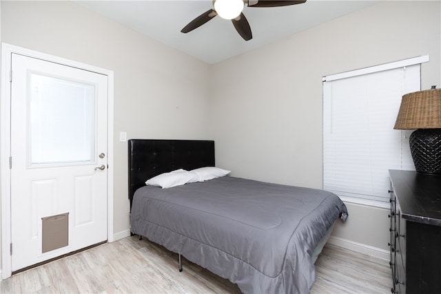 bedroom with light hardwood / wood-style floors and ceiling fan