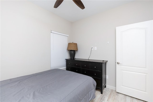 bedroom with ceiling fan and light hardwood / wood-style flooring