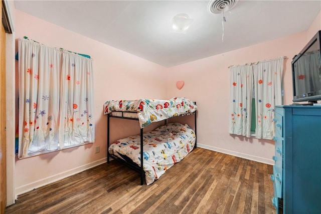 bedroom featuring dark hardwood / wood-style flooring