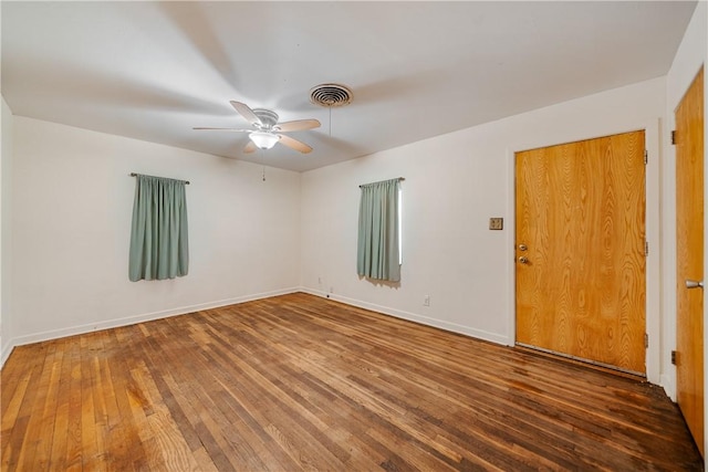 unfurnished room with ceiling fan and hardwood / wood-style floors