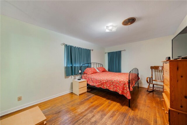 bedroom featuring hardwood / wood-style floors