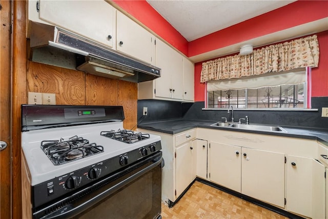 kitchen featuring white cabinetry, sink, and white gas range oven