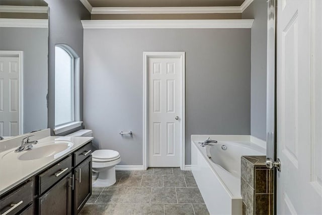 bathroom with a garden tub, toilet, vanity, baseboards, and ornamental molding