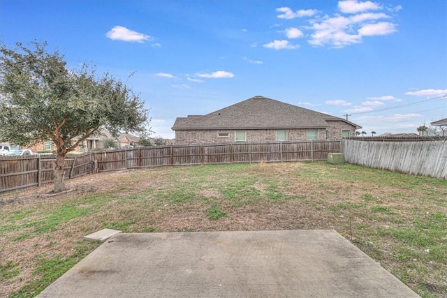 view of yard featuring a patio area and a fenced backyard