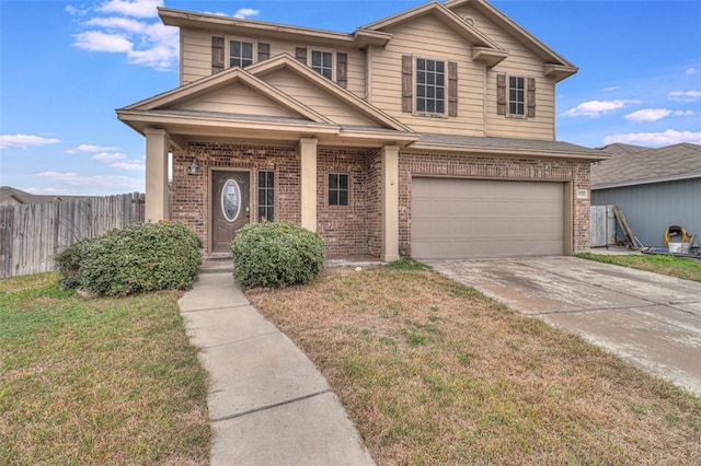 traditional-style house featuring brick siding, fence, driveway, and a front lawn